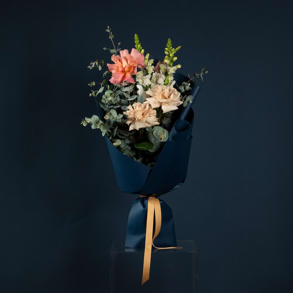 Blush Posy with peach and cream roses, white seasonal flowers and eucalyptus foliage