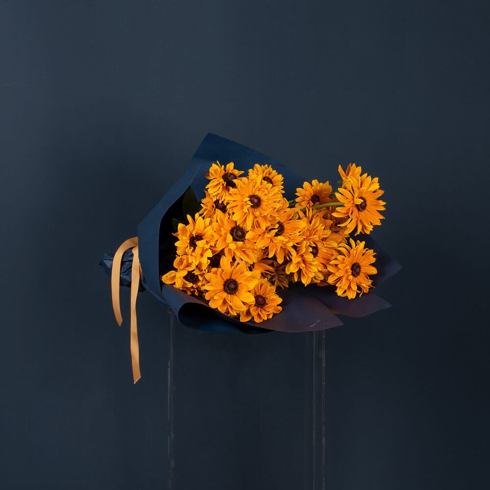 Market bunch of Rudbeckia with bright, cheerful yellow petals and dark centres, freshly sourced by If The Florist in Maroubra, Sydney.